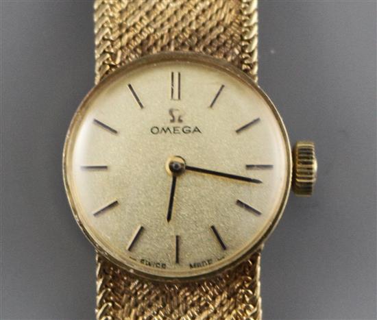 A ladys 1960s? 9ct gold Omega manual wind wristwatch, on integral textured 9ct gold Omega bracelet, gross weight 23.2 grams.